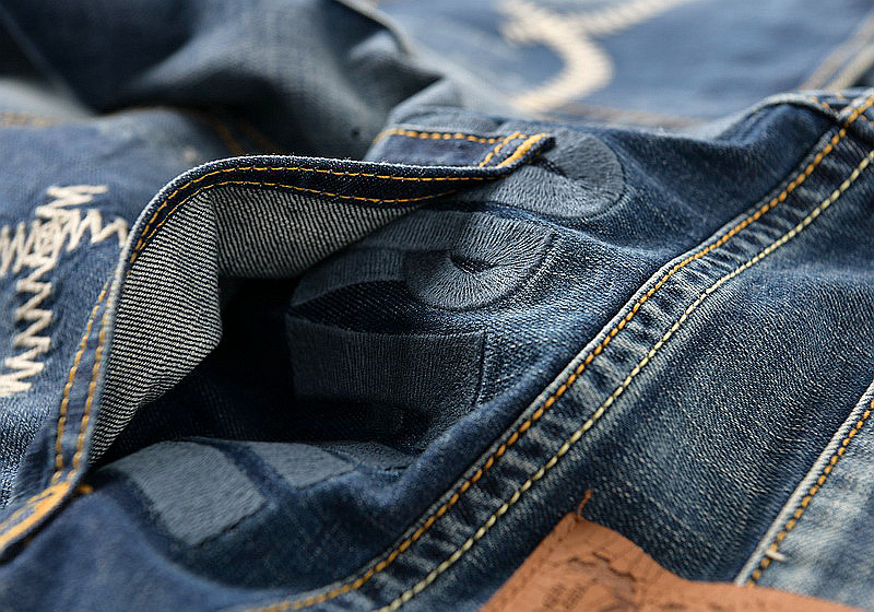 Foreign trade factory exports more than single tail single goods big cut label men's washed embroidery hole stretch slim jeans