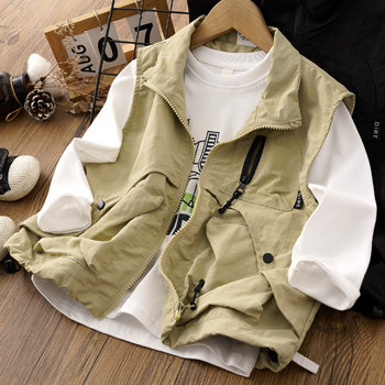 Boy's handsome work vest worn outside vest