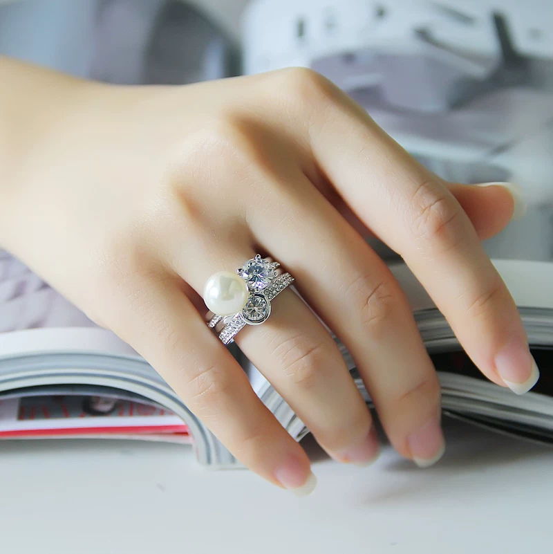 Fashionable ring pearl, accessory, on index finger