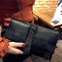 Tide brand leather bag women 2021 new clutch bag fashion personality rivets all-match envelope bag chain tassel bag