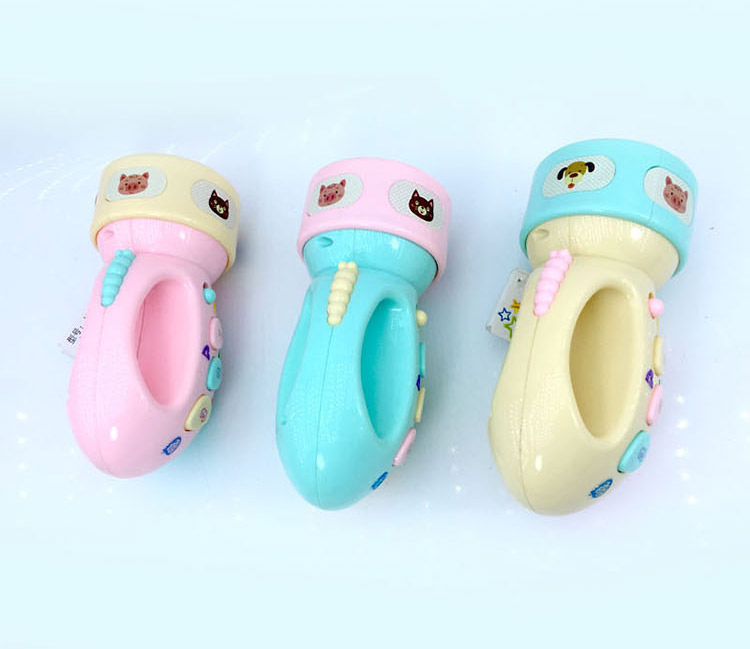 Trẻ em bé đèn pin đồ chơi câu chuyện máy nghe nhạc cậu bé chiếu câu đố thông minh giáo dục sớm máy Anh tro choi tre em