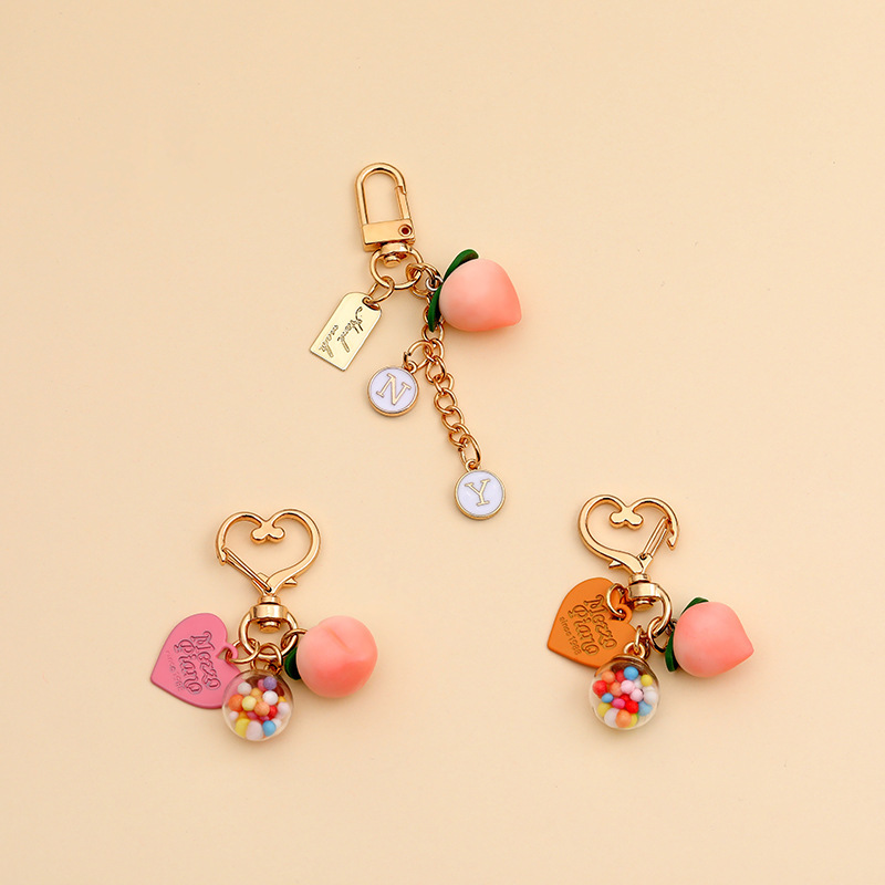 ins New Year Cute Peach Keychain Creative Colorful Ball Phone AirPods Chain Pendant Bag Gift Decoration