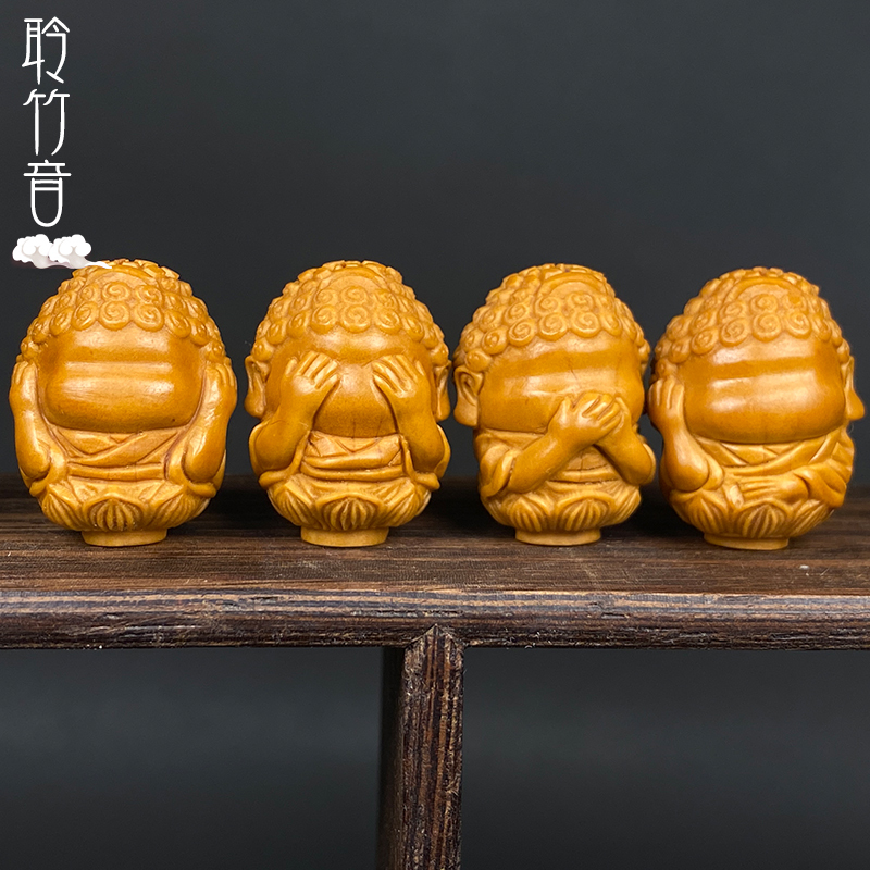 Olive Stone Carving of a Baby Buddha with Four Features, Symbolizing Wisdom, Silence, Non-Attachment, and Concentration; a Single Piece of Hand-Twisted Ornament with a Running Ring Accessory