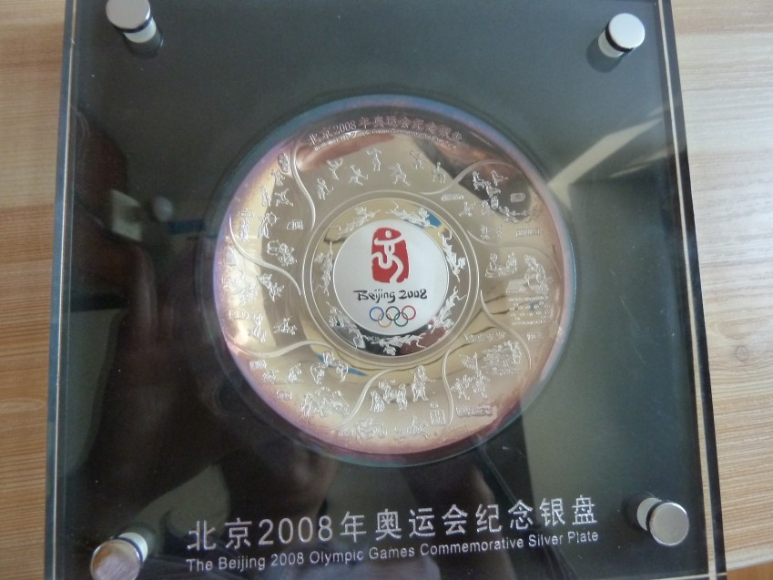 The first group of Olympic 8-ounce silver plates