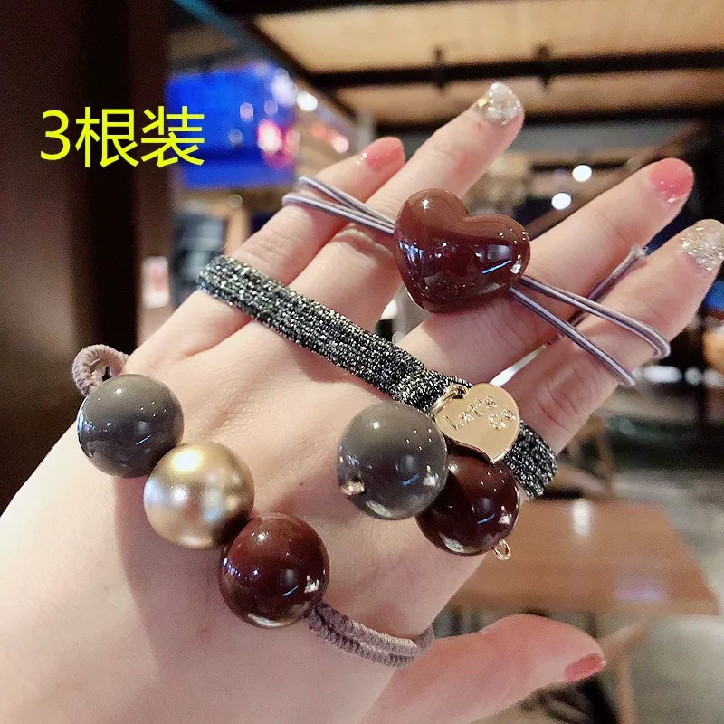 Korea Dongdaemun new knotted hair circle pearl pendant tie hair band lady wild hair trap combination