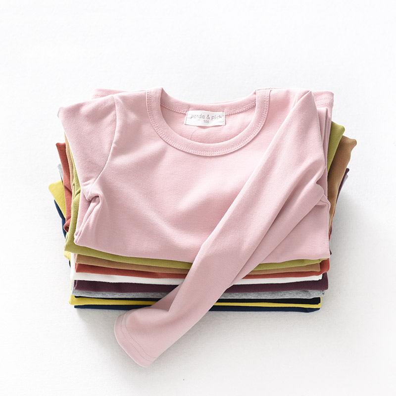 Sơn Đông cửa hàng quần áo trẻ em cửa hàng quần áo trẻ em cotton đáy quần áo trẻ em lớn tay áo thun dài tay màu kẹo áo thun bé trai