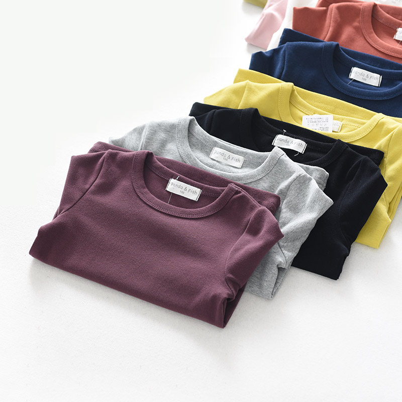 Sơn Đông cửa hàng quần áo trẻ em cửa hàng quần áo trẻ em cotton đáy quần áo trẻ em lớn tay áo thun dài tay màu kẹo áo thun bé trai