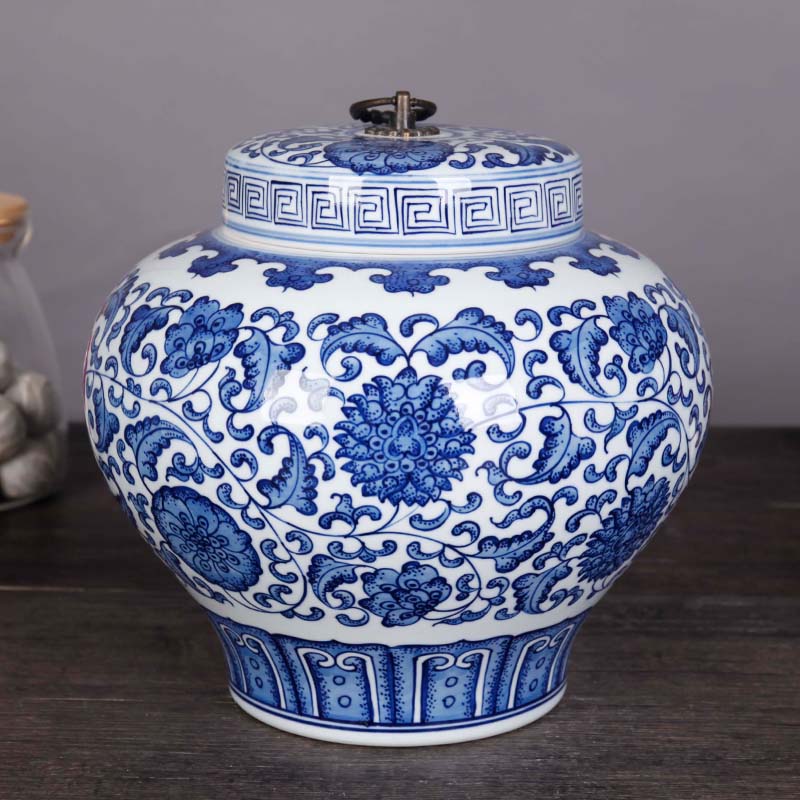 Jingdezhen ceramics pu 'er tea storage tank is blue and white porcelain lotus flower lohan pot home furnishing articles
