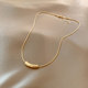 Retro simple golden cylindrical pendant snake bone necklace female 2022 new trendy light luxury niche exquisite clavicle chain