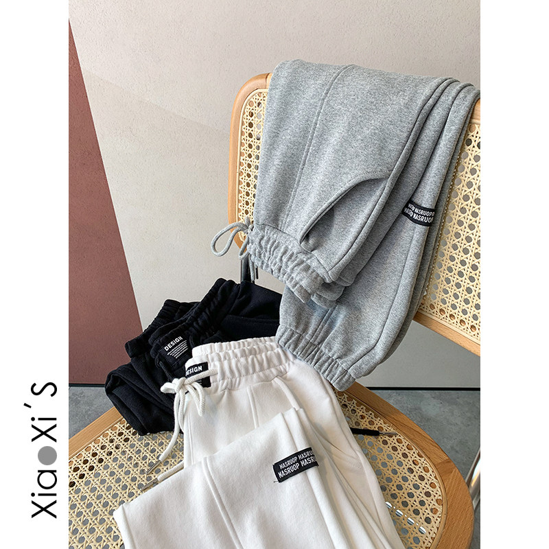 Xiao Xi Jia) cloth patch foot pants women's 2021 spring new Korean loose slim leisure sports long pants