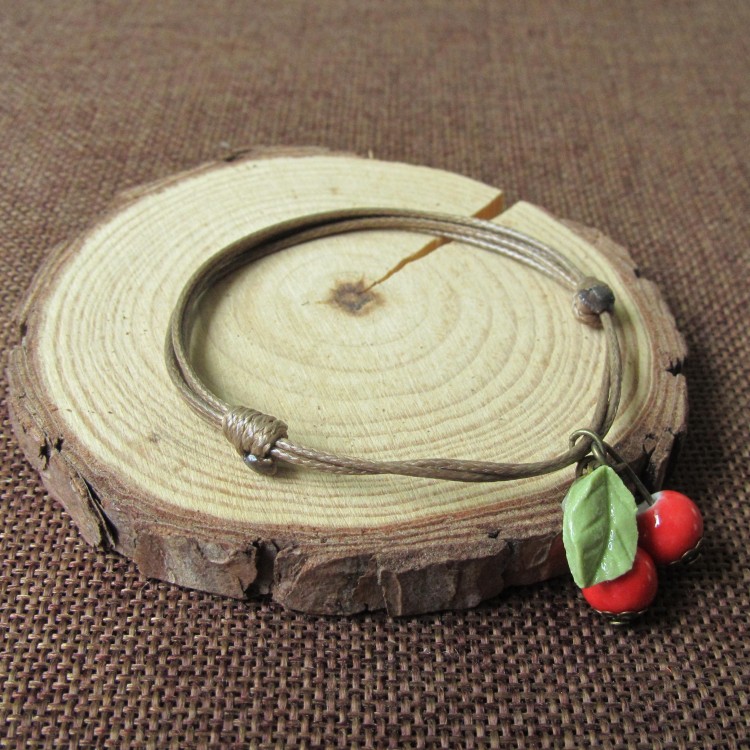 Phiên bản Hàn Quốc của thời trang vòng tay gốm cherry nữ quà tặng sinh viên ngọt ngào Jingdezhen trang sức gốm một nhân dân tệ vòng tay cao su