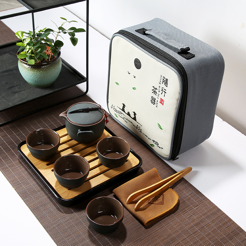 Travel ceramic Kung Fu tea set Outdoor travel portable bag Quick cup One pot four cups Household teapot tea tray