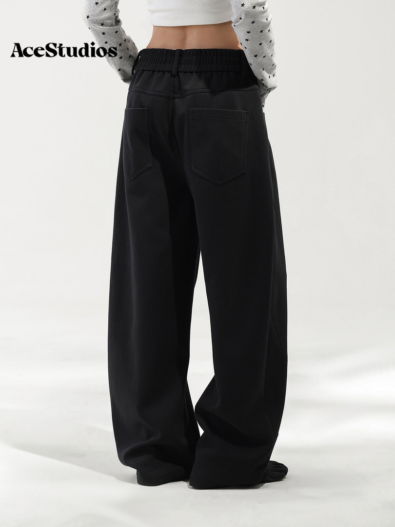 Model wearing black wide-leg pants