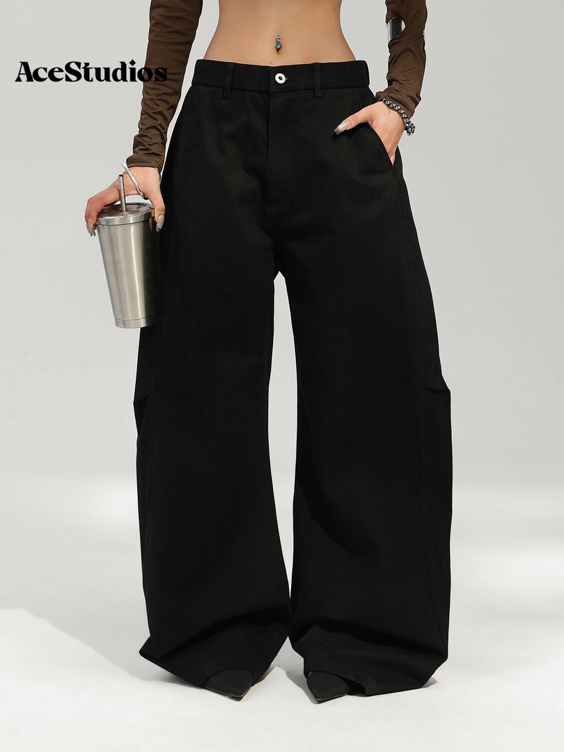 Black wide-leg pants modeled with a casual outfit