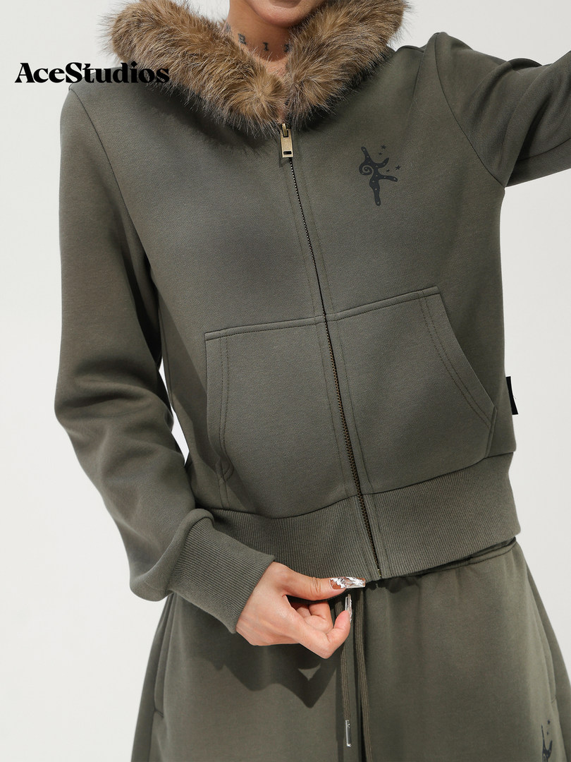 Olive green zip-up jacket with a cozy faux-fur collar shown on a model