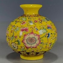 Collection of antiques and miscellaneous old objects enamel yellow glaze entwined flowers pomegranate statue decorative vase color boutique vase
