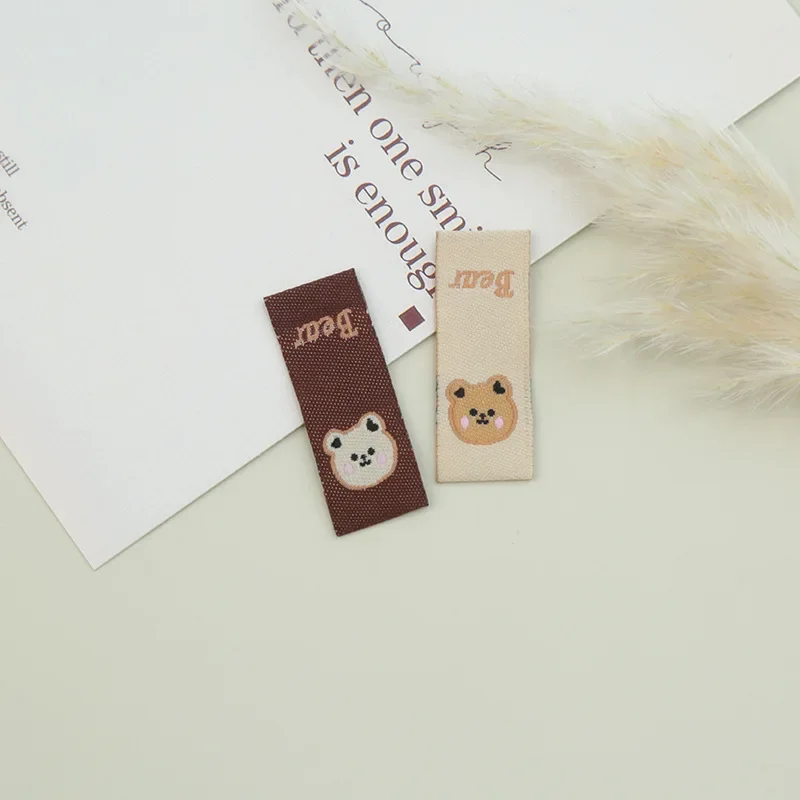 Cartoon weaving mark fabric label bear cloth standard accessories manual weaving mark back standard hair rope hair ring accessories manufacturers direct supply