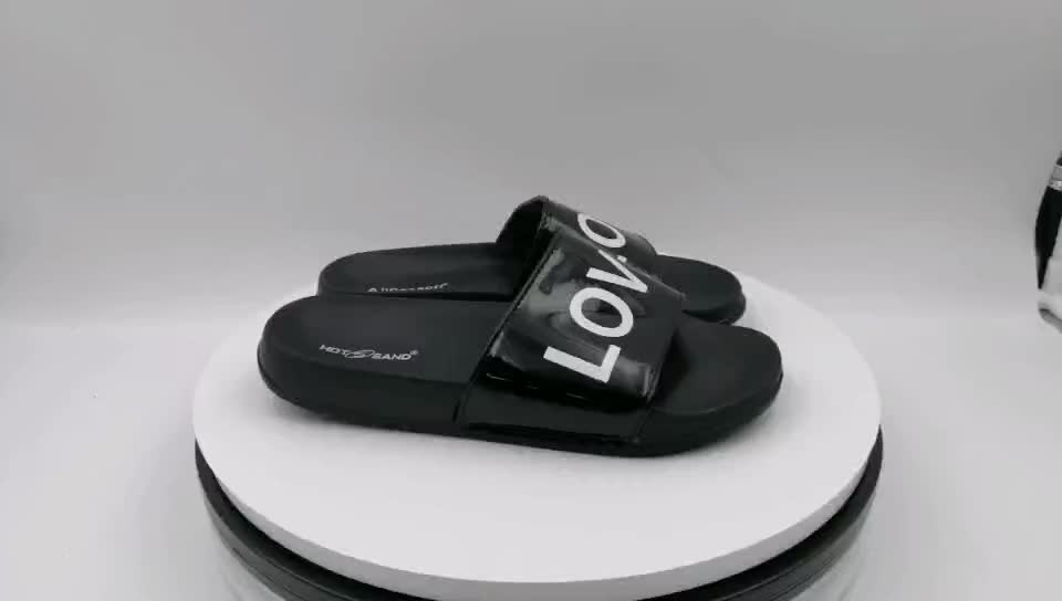 initials insignia cutout leather slides