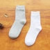 Vớ nam vớ cotton ống mùa thu và mùa đông màu trắng đen xám kinh doanh vớ nam bốn mùa vớ cotton thể thao khử mùi