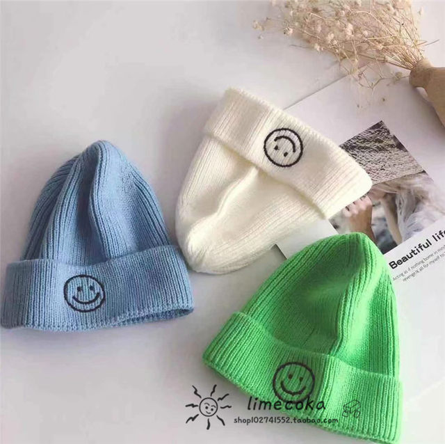Autumn and winter new style children's baby smiling face fluorescent color woolen hat knitted hat boys and girls melon skin hat