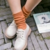 Vớ Hàn Quốc nữ mùa thu và mùa đông ống dài vớ cotton rắn màu nữ sọc dọc