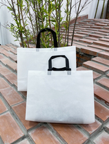 Milky white film Non-woven handbag custom waterproof shopping gift Womens packaging bag clothing shop clothes bag