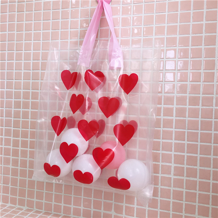 Red hand-held gift bag for a caring girl, transparent plastic shopping bag with a heart, ins jelly bag, portable bag