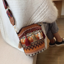 ins Super fire bucket bag women bag 2020 new wide shoulder strap National style one shoulder shoulder bag leisure tassel bag