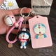 Doraemon Mũ bảo hiểm Jingle Keychain Chủ thẻ Phim hoạt hình Cặp đôi Chuông xe Mặt dây chuyền Túi dễ thương Treo đồ trang sức - Vòng đeo tay Cuff