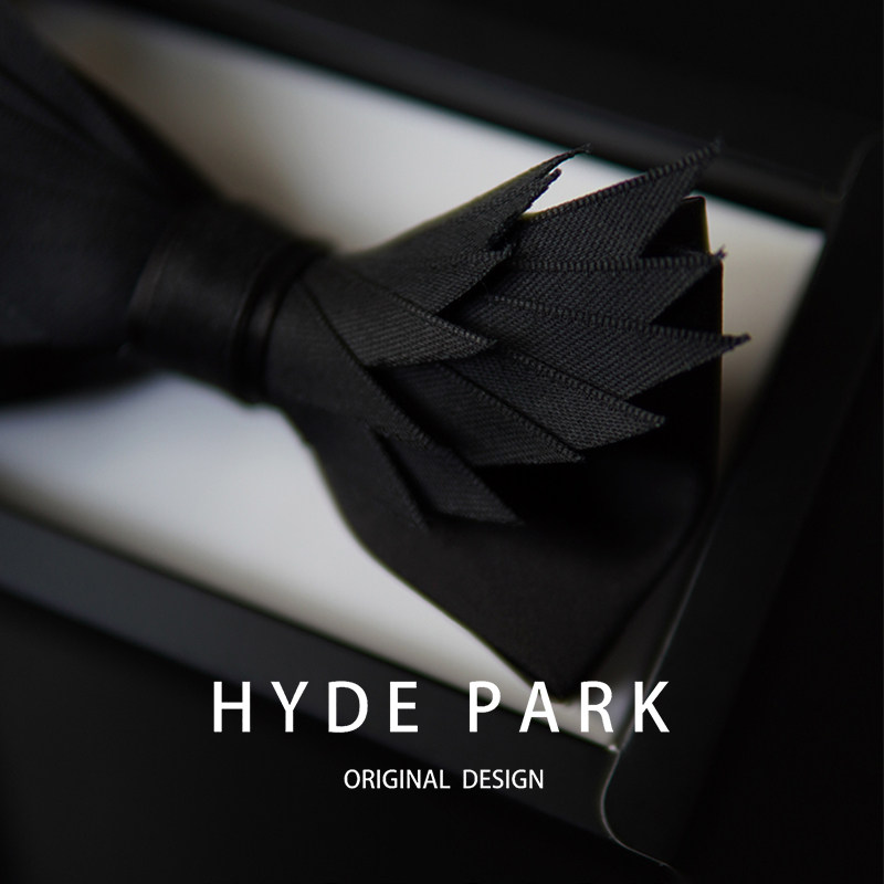 Hyde Park's original "Black Feather" dinner host exudes sophistication with a black bow tie, wedding groom's bow tie, and boutonniere.