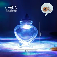 Темно -пурпурное маленькое персиковое сердце со светом