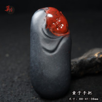 Guilin chicken blood jade and white sculpture boy hand to piece black red rock stone dry - kun material Hongyun collection