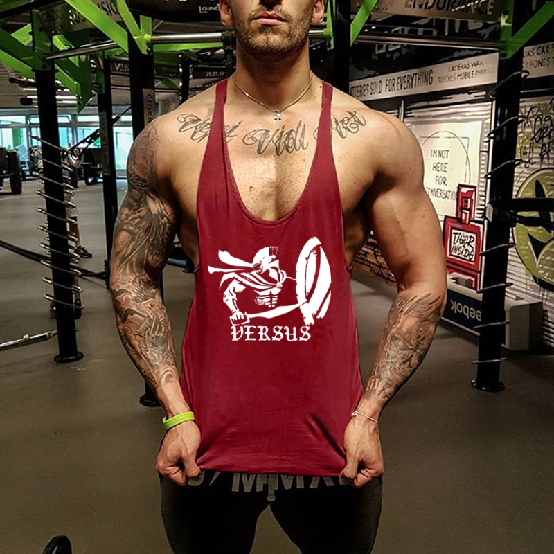 Cotton thể hình thể hình vest cơ bắp nam giới thể thao lỏng lẻo đào tạo sling tay áo đào tạo thấm hút mồ hôi thủy triều áo 3 lỗ nam rộng nách