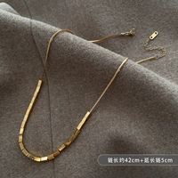 Маленькое колье из титановой стали с золотым слитком