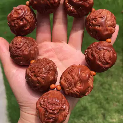 Wenwen hand string men's olive core carving Kowloon Xianrui holding Indonesian olive core pure hand carving Kowloon