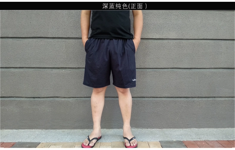 Quần short cotton của nam giới mùa hè quần ở nhà rộng rãi đồ ngủ cộng với chất béo cộng với kích thước quần short cotton thể thao đi biển quần năm điểm - Quần tây