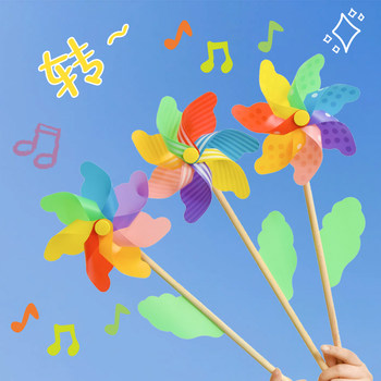 Colorful windmill wooden pole for spring outing picnic photo