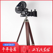 Nostalgic old cinema player German antique Alai Arriflex 16mm motion picture film camera solid wood tripod