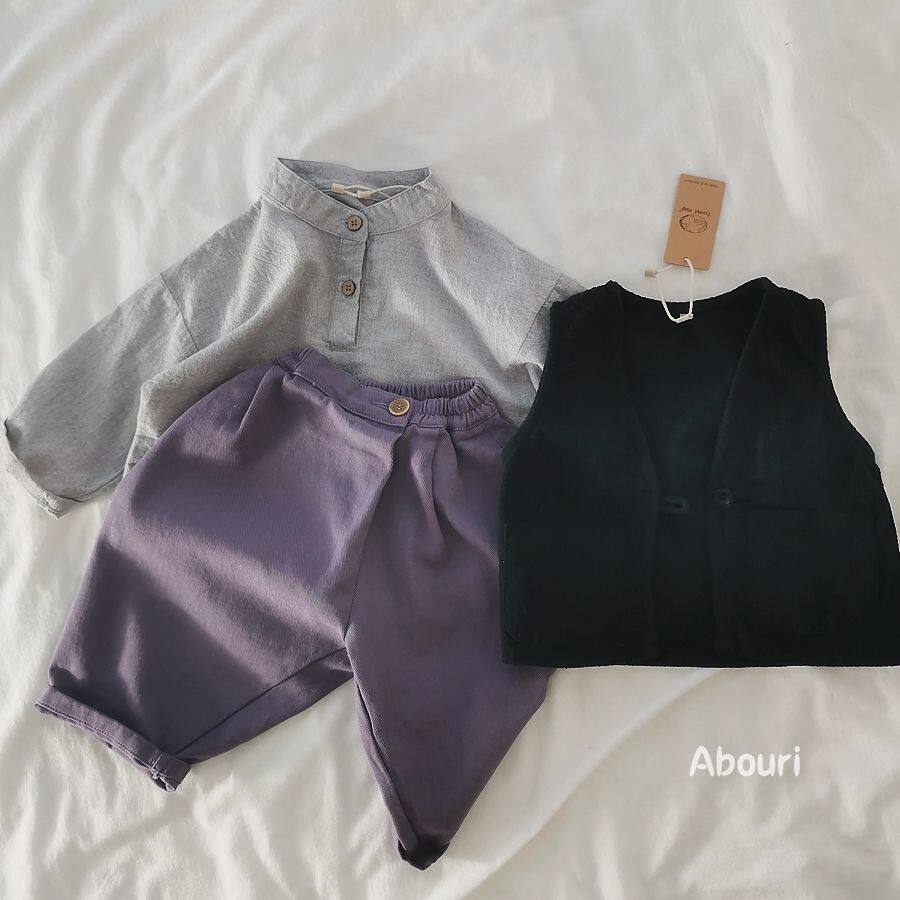 Strongly recommended clothing style 2022 Spring Korean children's skewed design slant washing cotton boys and girls casual collapse