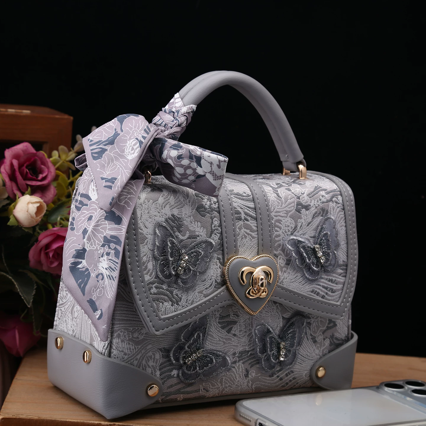 Handheld bag, genuine leather, with embroidery