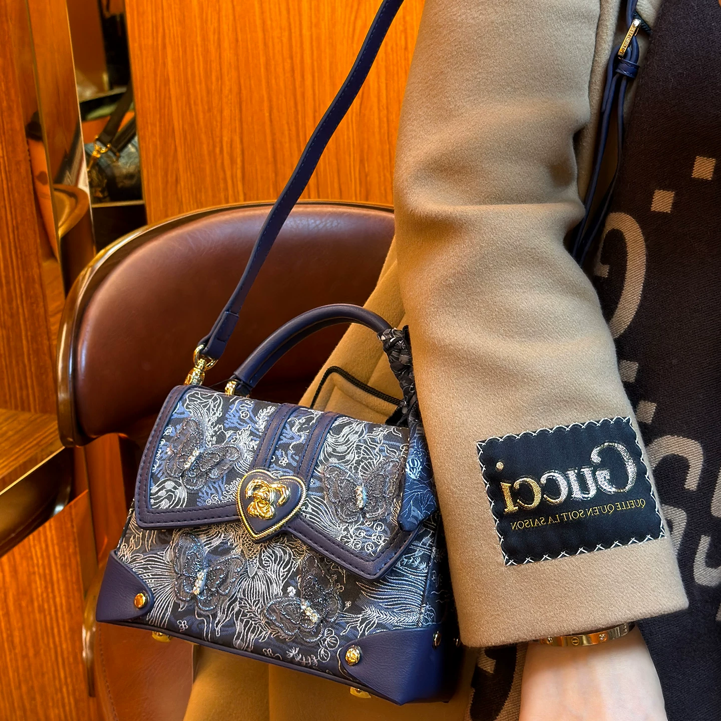 Handheld bag, genuine leather, with embroidery