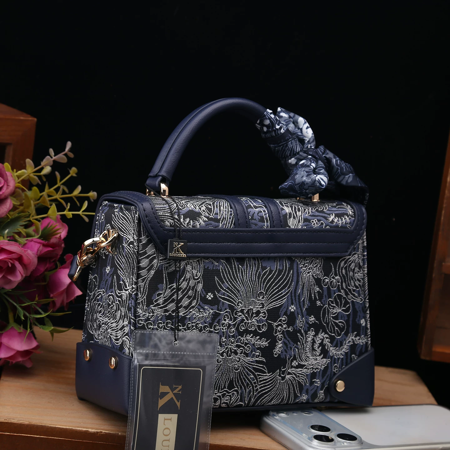 Handheld bag, genuine leather, with embroidery
