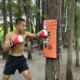 Boxing training target with ring tag tied to tree stump
