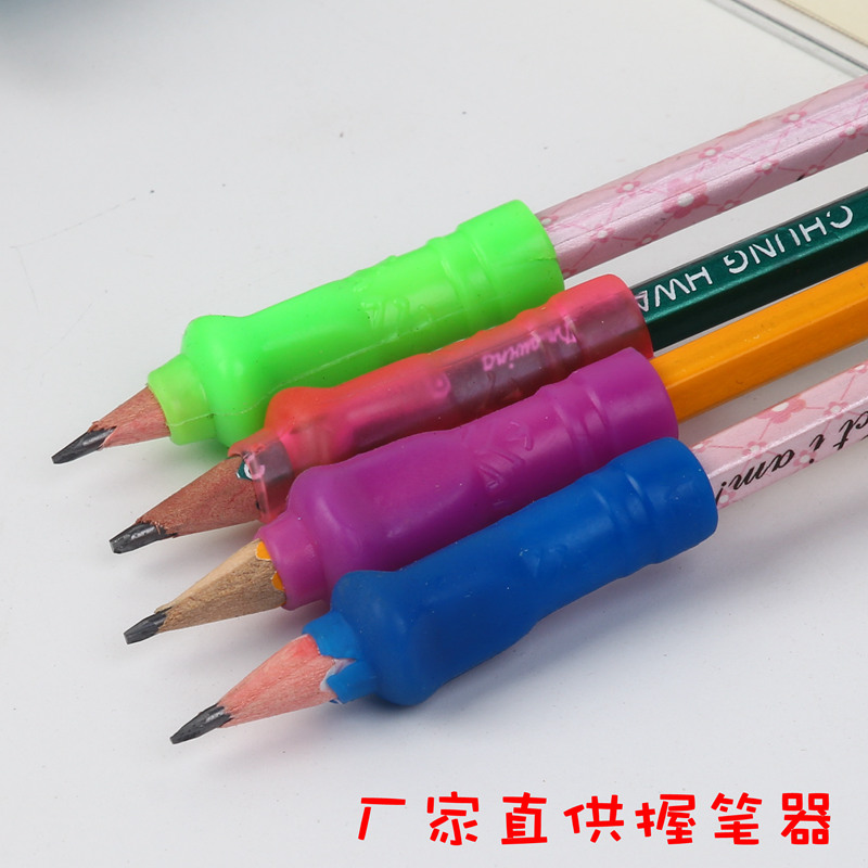 Manufacturer straight for children holding pens pens for primary school students holding pens straightener pencil sleeve correction and writing posture pen cap wholesale