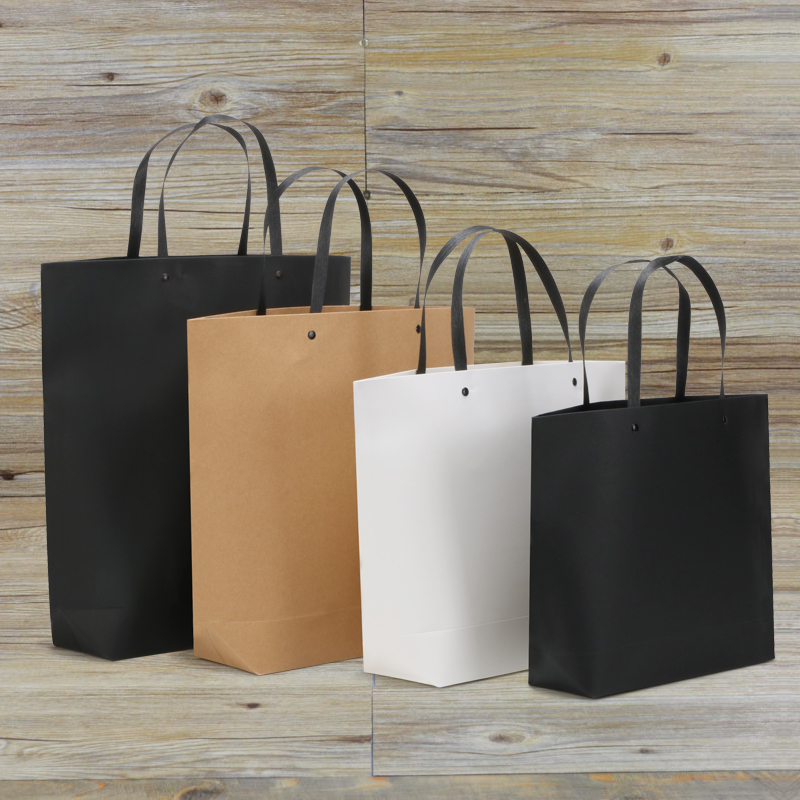 Clothing paper bags in stock full ten free shipping gift bags custom-made rivets hand-held packaging bags printed solid color kraft paper bags