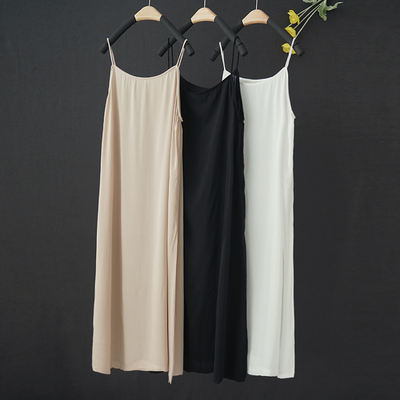 A loose, mid-length, large-sized, thin, breathable and soft women's dress with a halter top for summer wear