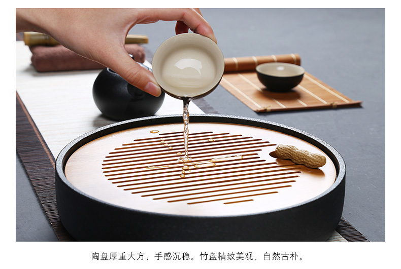 Black pottery tea tray ceramic portable travel bag of a complete set of kung fu tea set suit Japanese household dry teapot teacup