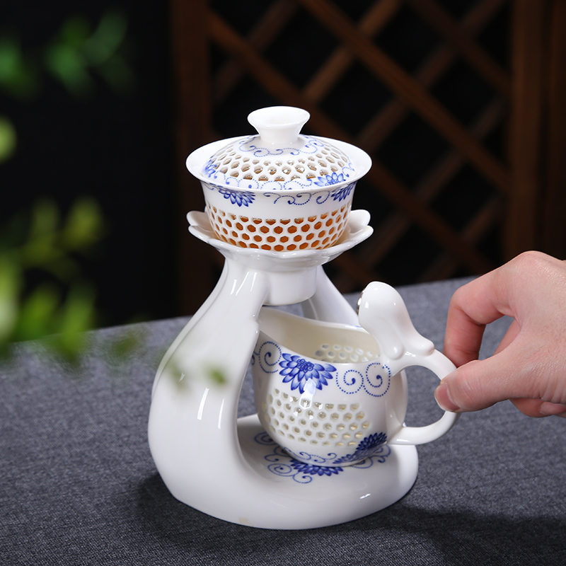 Friends is a complete set of automatic water and exquisite blue and white hollow out tea set suits for against hot insulation teapot