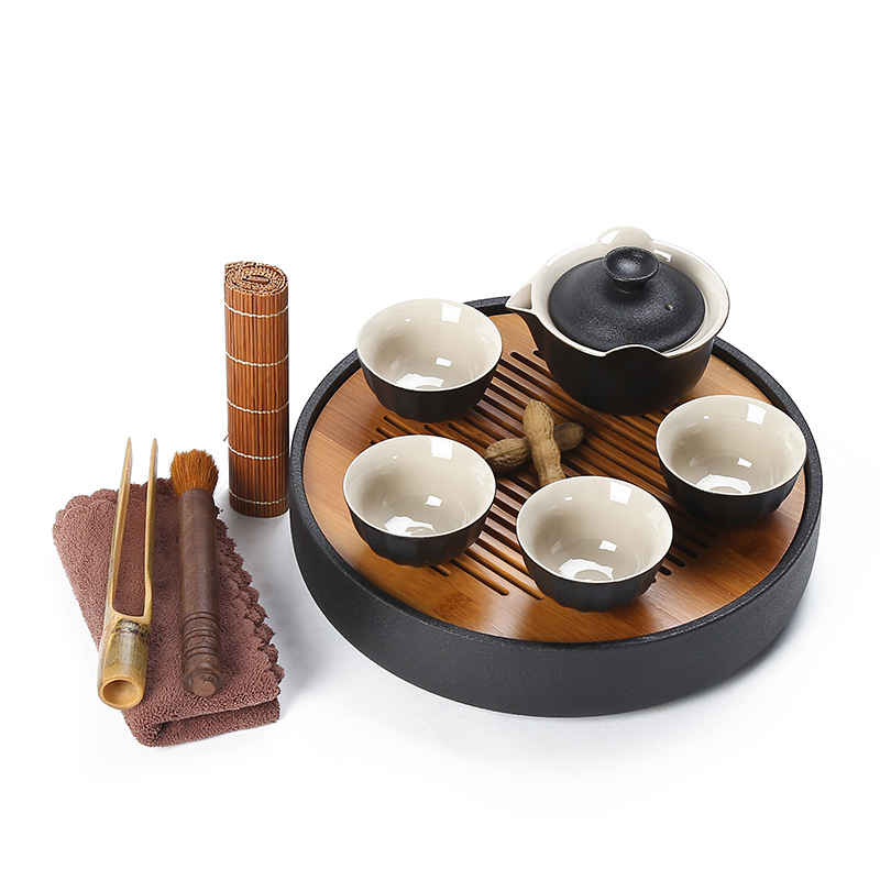 Black pottery tea tray ceramic portable travel bag of a complete set of kung fu tea set suit Japanese household dry teapot teacup