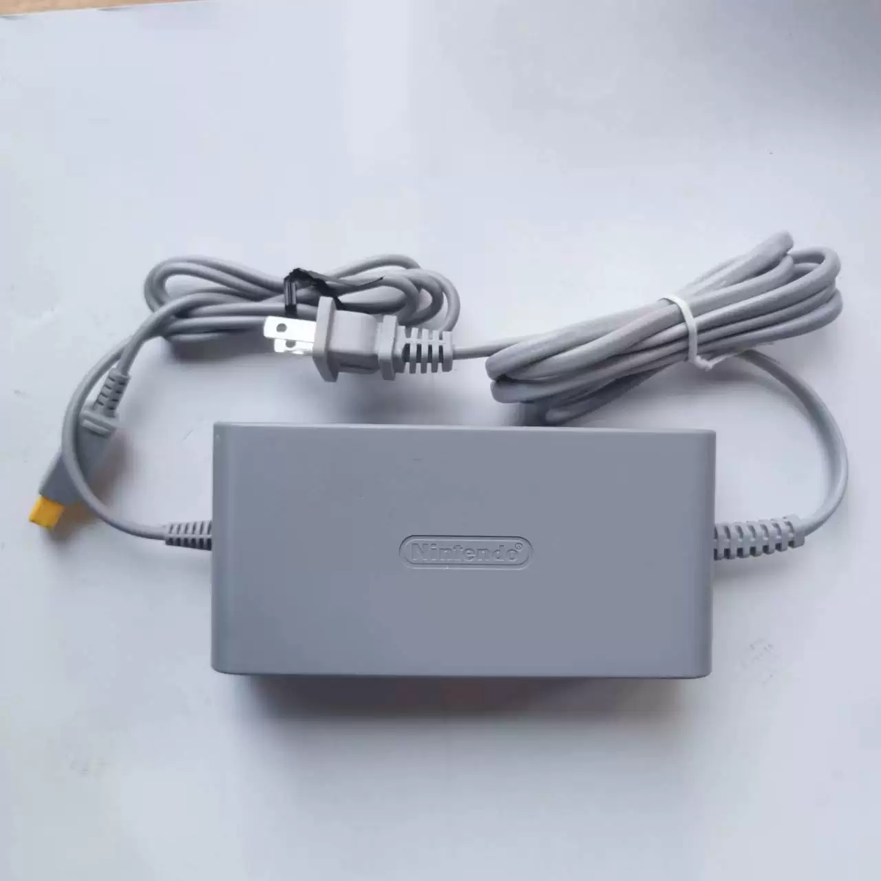Game console, genuine power supply, power adapters